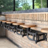 get back inc swing-out seats, bar stools for indoor use attached to standard brick wall indoor kitchen, tuck under bar, very strong more durable than traditional seating, all made of steel and wood so longer lasting than standard bar stools