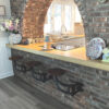 get back inc swing-out seats, bar stools shown here for indoor use attached to brick wall, strong durable support made of steel and wood best lasting bar stools